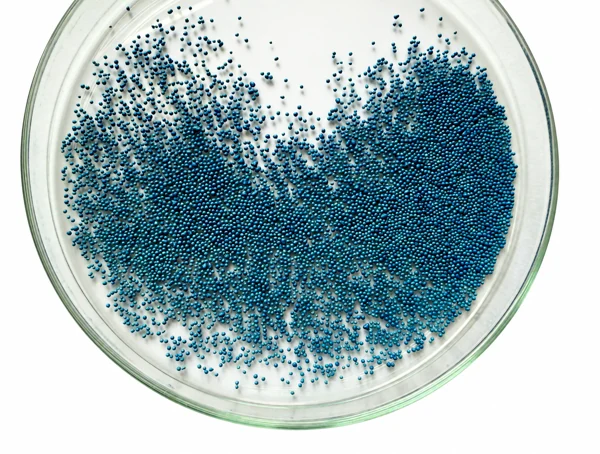 Pelleted seeds in a glass dish