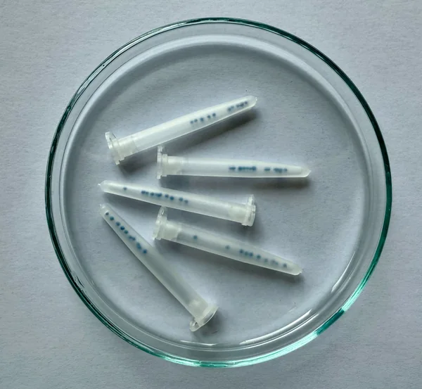 Close-up of a plastic vial containing Petunia pellets